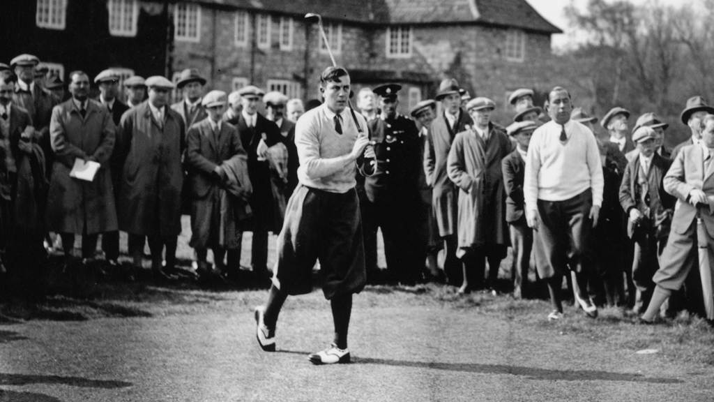 British golfer Henry Cotton (1907 - 1987) is watched by America's Walter Hagen (1892 - 1969) as he takes his turn at the 10th during the British Open Golf Championship at Muirfield 1929 (Getty)