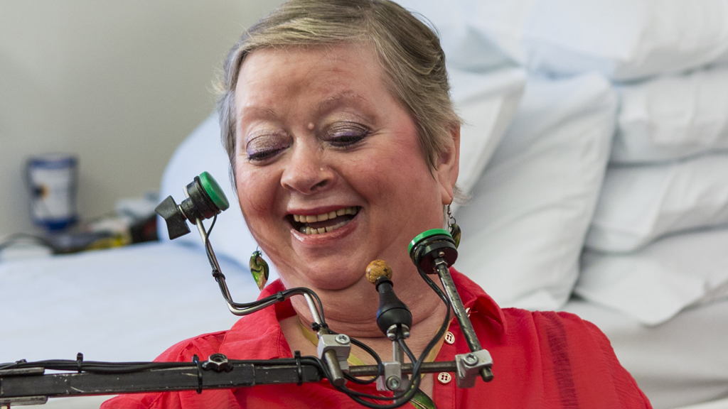 Deirdre Tydd uses her chin to move her wheelchair.