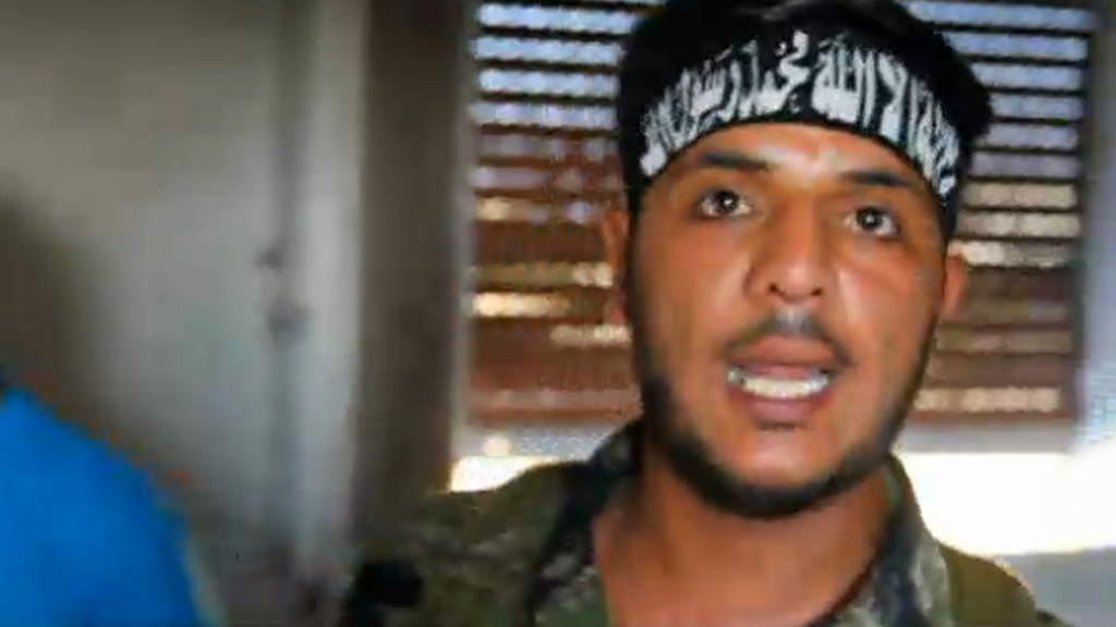 Rebel fighter Abu Sakkar caught on camera in August 2012.