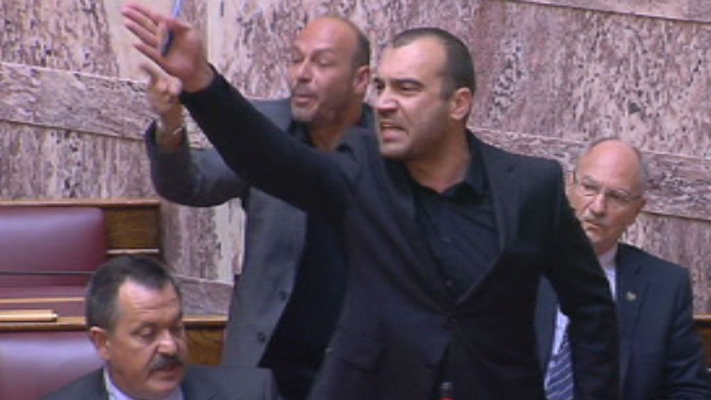 Uproar erupts in the Greek parliament as an MP from the far-right Golden Dawn party is expelled amid shouts of 