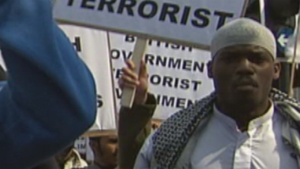 Man believed to be Michael Adeboloja at 2007 demonstration (ITN)