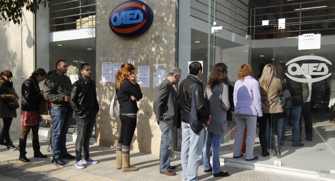 Unemployed Greeks queue at a job centre in Athens