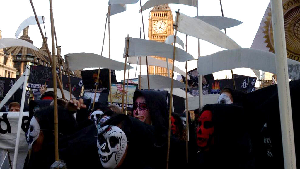 Two separate protests are held at Parliament Square against Sri Lanka's hosting of the meeting of Commonwealth leaders. Protesters dressed as grim reapers highlight the deaths of 40,000 Sri Lankans.