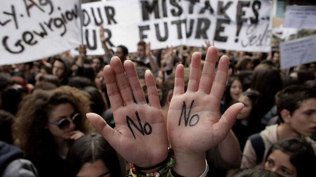 Cypriot college students shout slogans during a protest in Nicosia against a bailout for the financially crippled island in March (G/R)