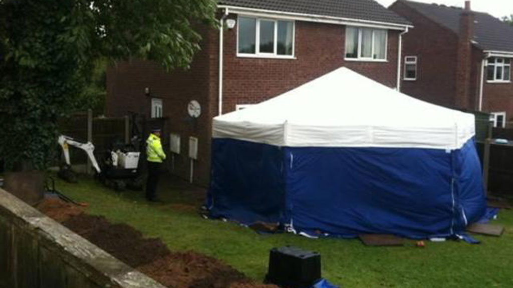 The remains of two people are found in a garden in Nottinghamshire and forensic tests are being carried out to identify them.