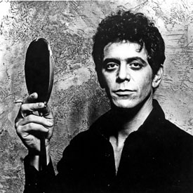Lou Reed posing for a portrait in the 1970s, with a mirror (getty)