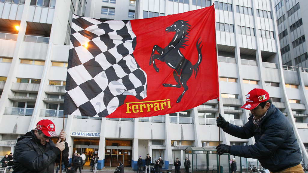 Ferrari fans outside the hospital where Schumacher is being treated (Reuters)