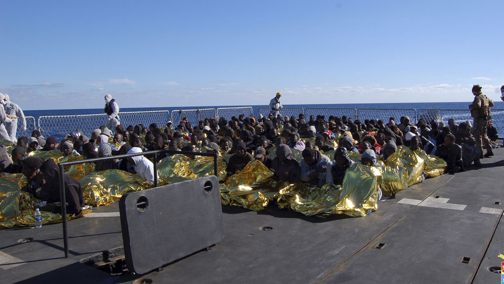 Migrants aboard an Italian navy vessel after being rescued near Lampedusa (picture: Reuters)