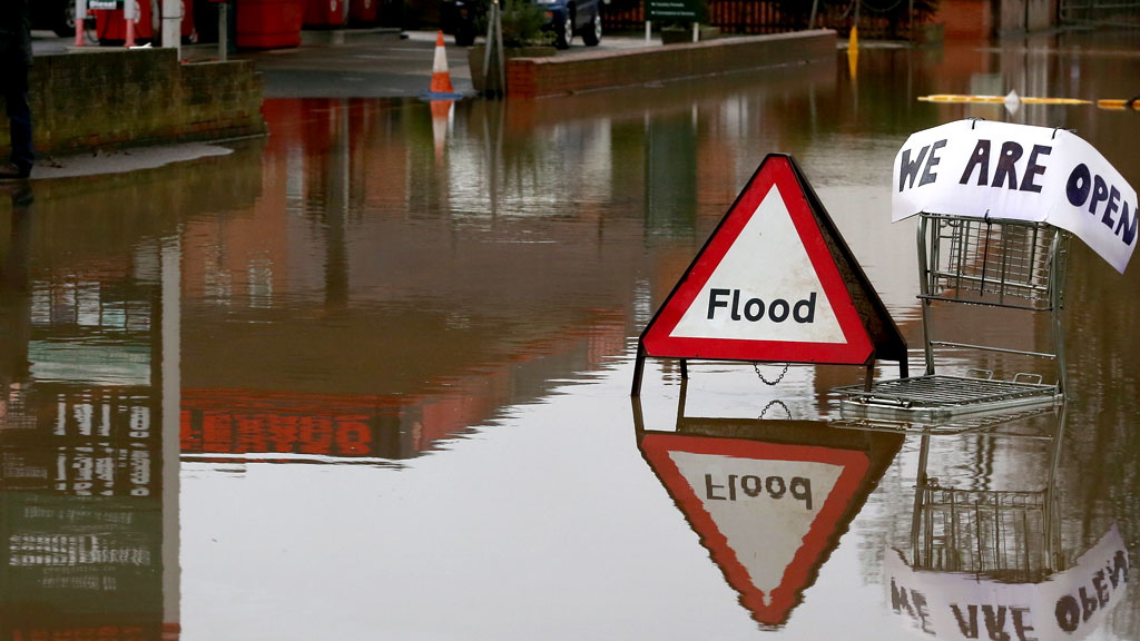 Picture: a flood sign stands beside a petrol station close to the River Severn at Upton upon Severn (G)