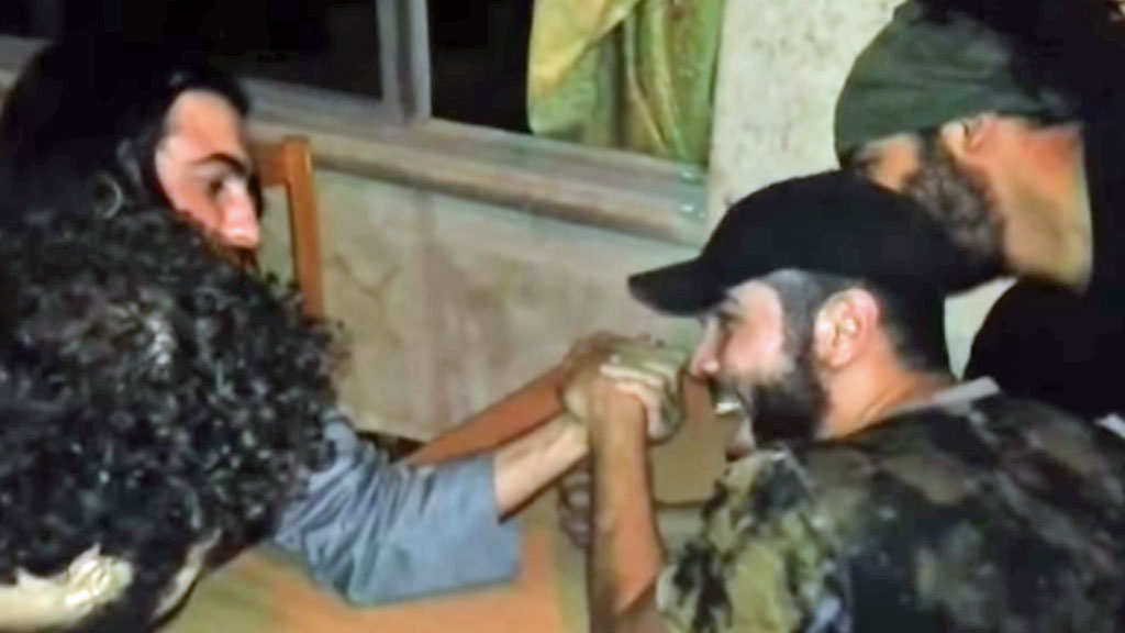 Isis insurgents arm-wrestling
