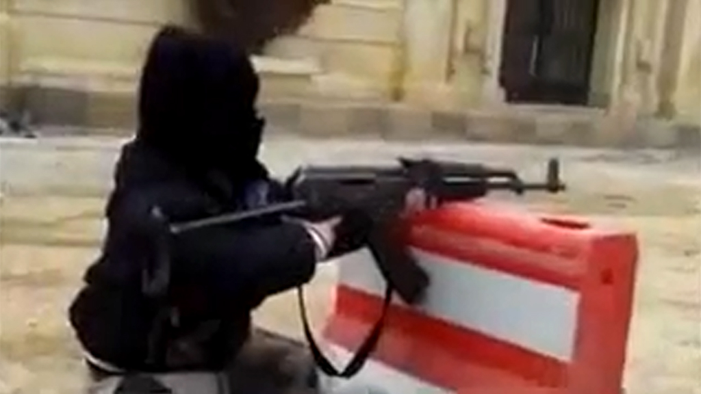 Islamic State boy firing gun
