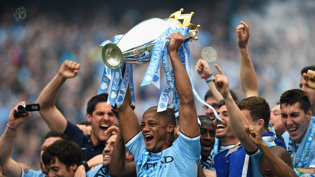 The Manchester City team celebrate winning the Premier League title in May 2014 (Getty)