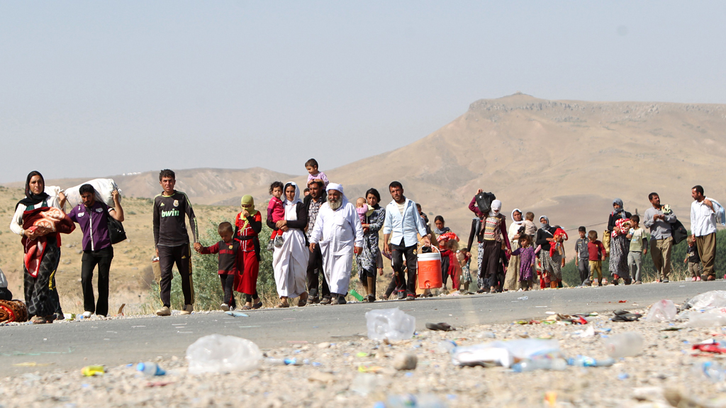 Yazidi people fleeing Mount Sinjar