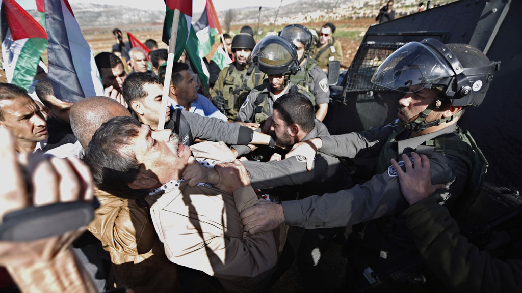 Ziad Abu Ein scuffles with Israeli troops shortly before his death (Reuters)