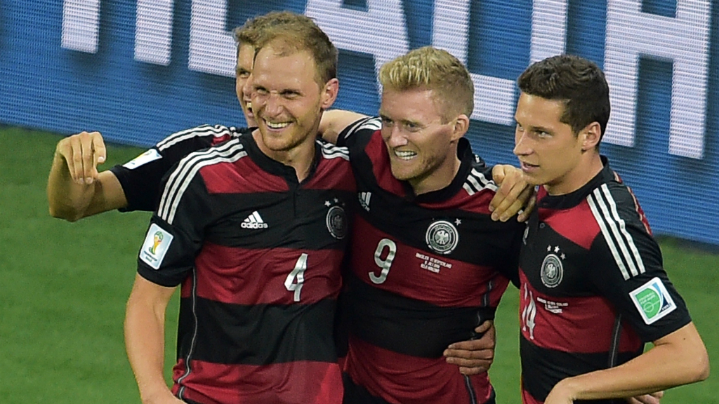Germany forward Andre Schuerrle celebrates with Germany's defender Benedikt Hoewedes and Germany's midfielder Julian Draxler. (Getty)