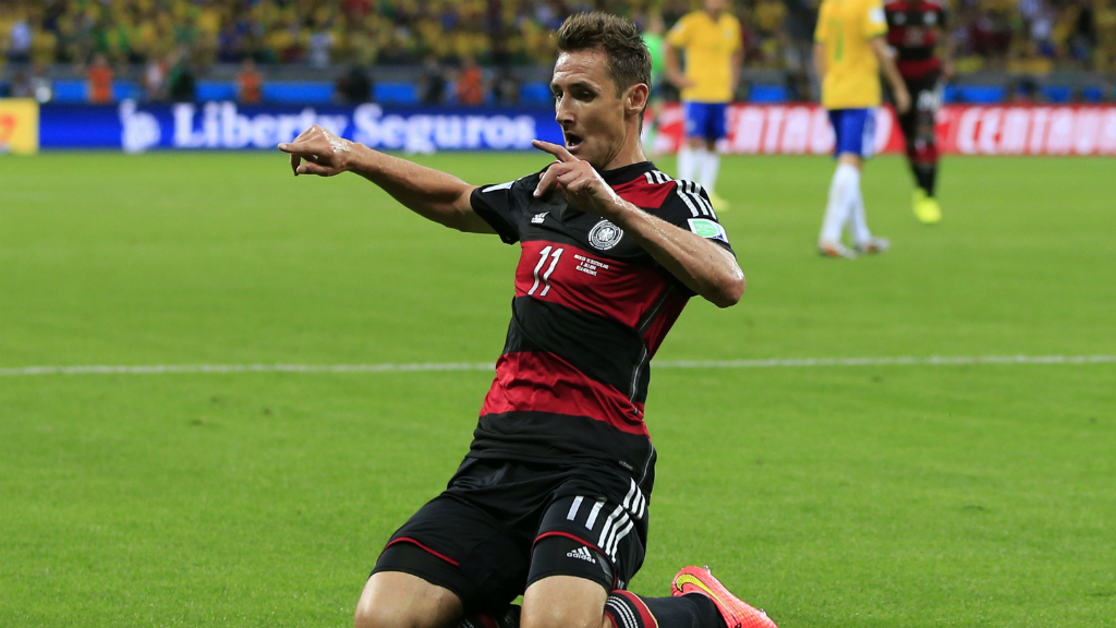Miroslav Klose celebrates scoring against Brazil.