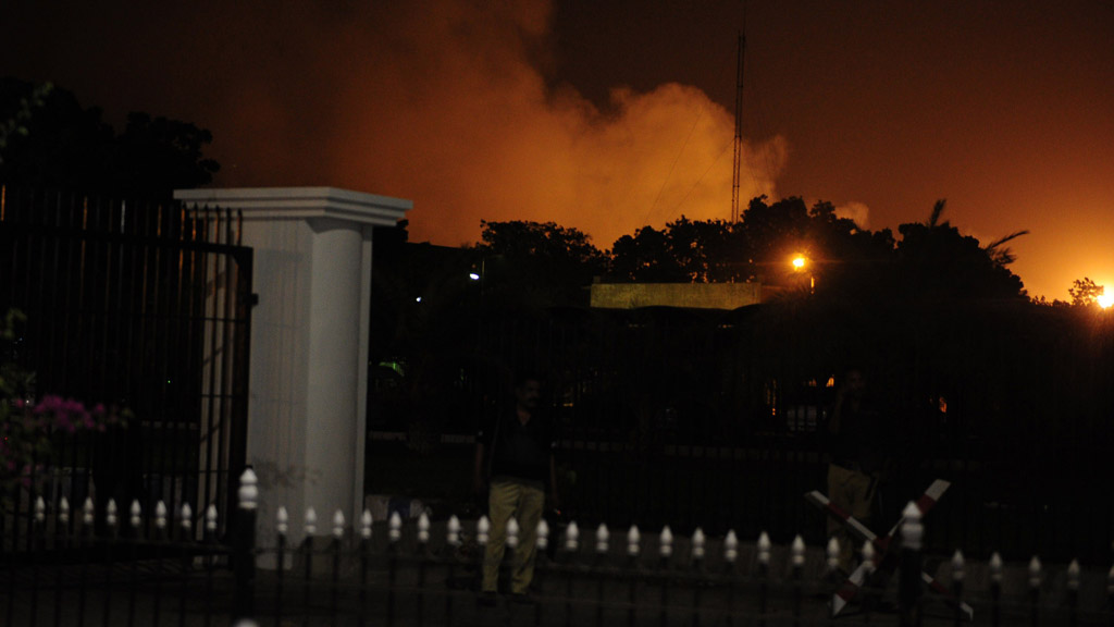Smoke rises from Jinnah International Airport after an assault by gunmen (Getty)
