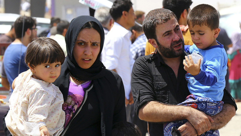 Iraqi family that has fled Mosul (picture: Reuters)