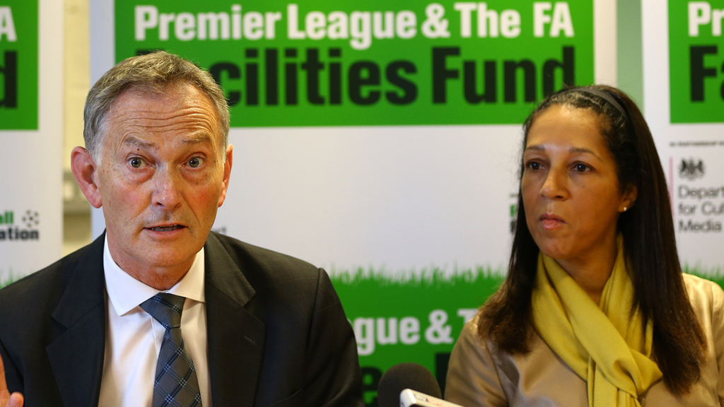 Premier League Chief Executive Richard Scudamore (L) and Minister of Sport and Equalities Helen Grant
