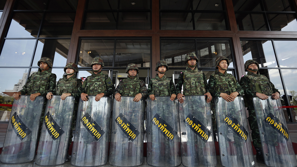 Thailand's army chief summons the country's political leaders to talks the day after declaring martial law, but they fail to reach a conclusion (Reuters)