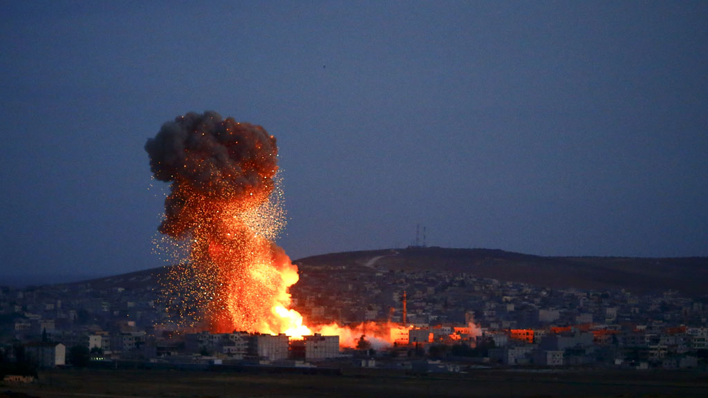 Flames and smoke rise from Kobani (Reuters)
