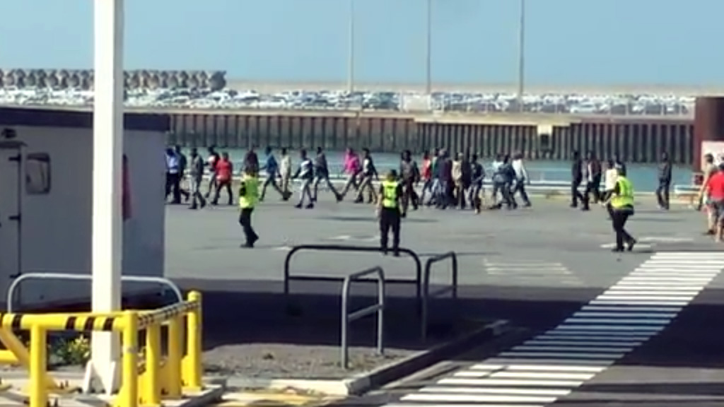 Migrants attempt to storm Calais ferry
