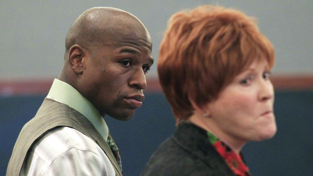 Floyd Mayweather stands next to his attorney in court (Reuters)