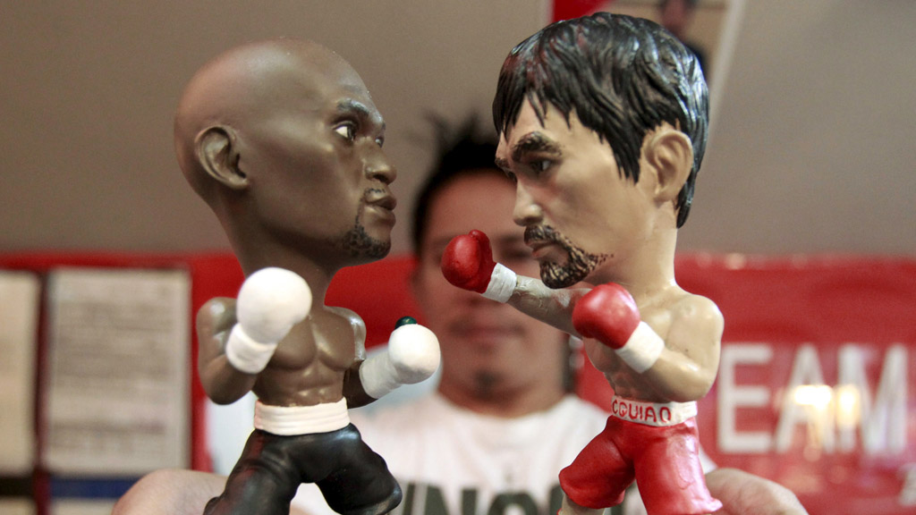 Floyd Mayweather and Manny Pacquiao figurines (Reuters)