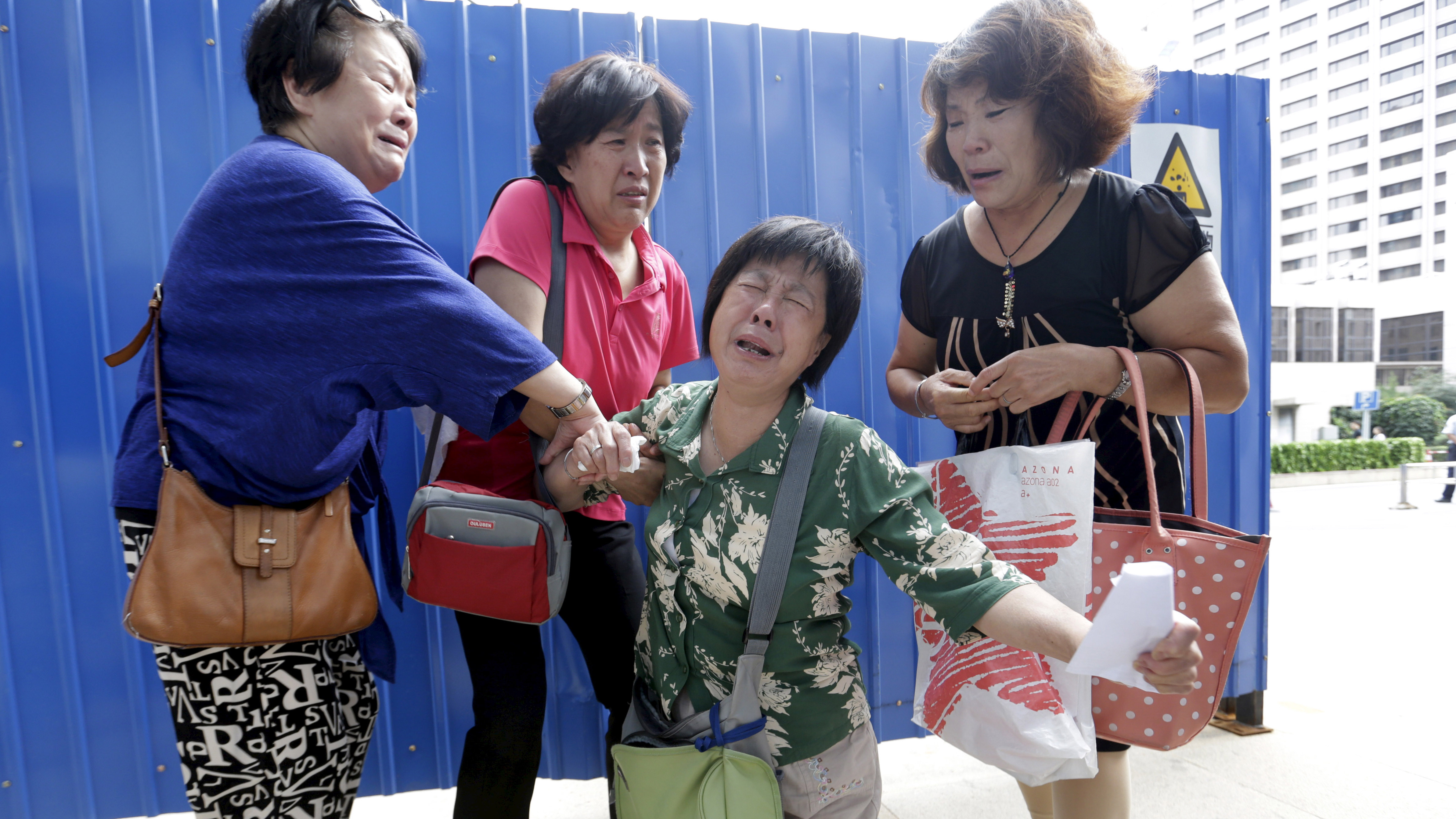 Grieving relatives in Beijing (Reuters)