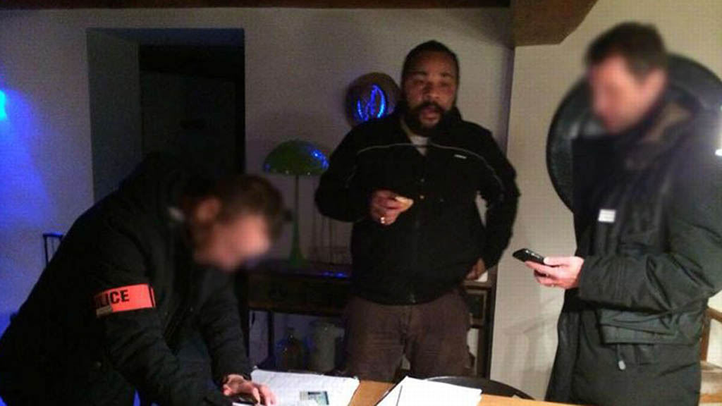 Photo posted by Dieudonne on his Facebook page of police at his apartment 