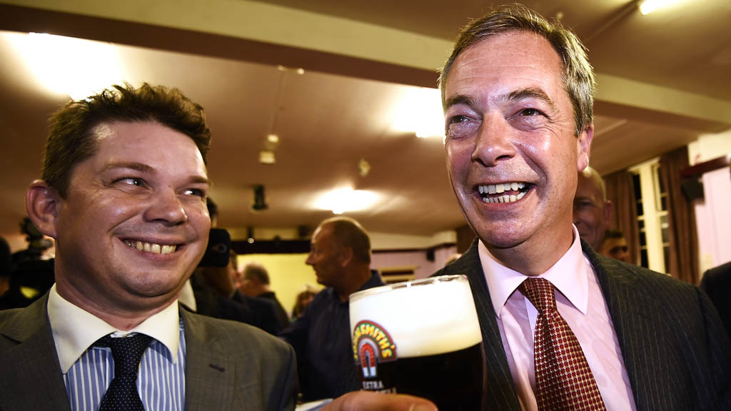 Ukip leader Nigel Farage holding a pint of beer (Reuters)