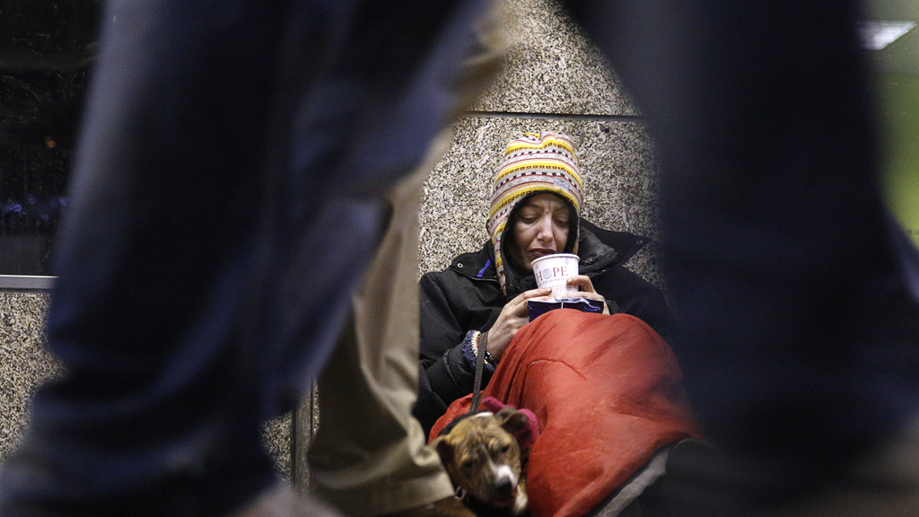 It is bitterly cold, you notice a rough sleeper in a doorway and wonder what you can do. Here is how you can help (Reuters)