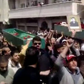 A funeral procession in Deraa for a Syrian pro-democracy protester (Reuters)