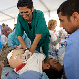 Inside Misrata: hospital staff try to resuscitate an injured man. (Getty)