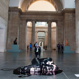 A protester from 'Liberate Tate' covered in oil (Immo Klink)