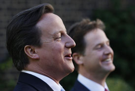Britain's Deputy Prime Minister Nick Clegg smiles after Prime Minister David Cameron made a joke during an addrese to guests at the Gay Pride reception in the garden at 10 Downing Street, in central L