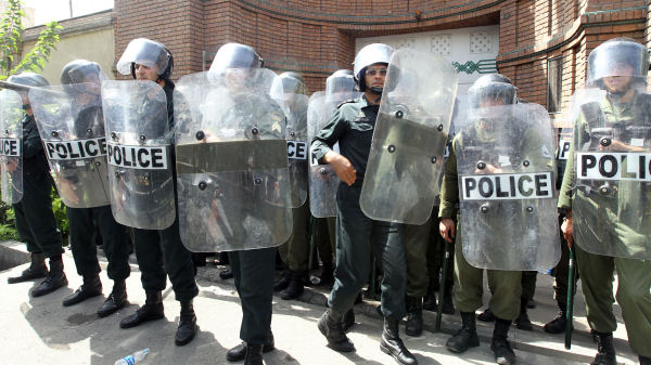 Iranian riot police stand guard in Tehran. (Getty)