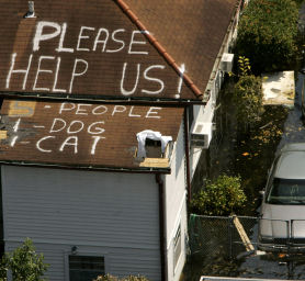 People trapped in their houses after Hurricane Katrina, 2005 (Reuters).