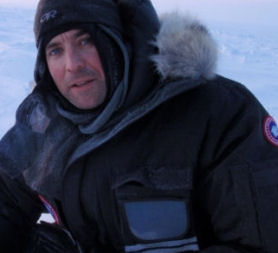 Tom Clarke in the arctic preparing for his first night sleeping on the ice.
