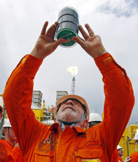 Brazil's President Lula da Silva observes the first oil of the Pre-Sal at Baleia Franca camp in July 2010. (Getty)
