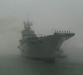 HMS Ark Royal aircraft carrier arrives in Portsmouth on its final journey 