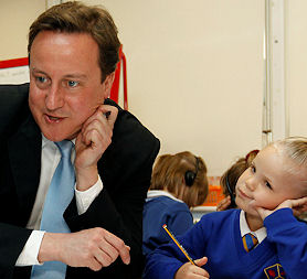 Prime Minister David Cameron talks to school children (Reuters)