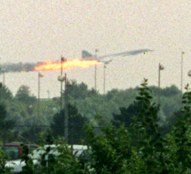 Flames come out of the Air France Concorde seconds before it crashed in Gonesse near Paris Roissy airport, 25 july 2000. The crash killed at least 112 people.