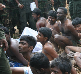 Tamil men pictured with soldiers in Sri Lanka 