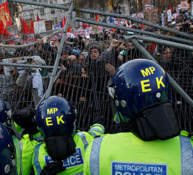 Demonstrators clash with police during the tuition fees protest in London (Reuters)