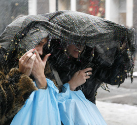 Shoppers brave the cold in London's West End. Reuters