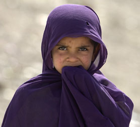 An Afghan girl looks at the camera in the Arghandab valley in Kandahar province, southern Afghanistan (Reuters)