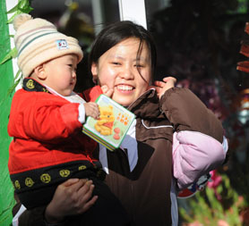 What does she know? A mother and child in Beijing (Getty)