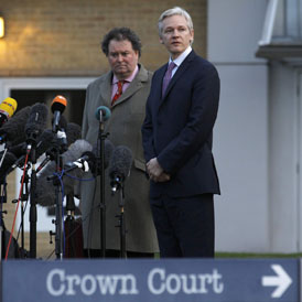 WikiLeaks founder Julian Assange and lawyer Mark Stephens speak to the media as they leave Belmarsh Magistrates Court in east London (Reuters)