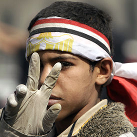 pAn anti-government protester gestures inside Tahrir Square in Cairo (Reuters)